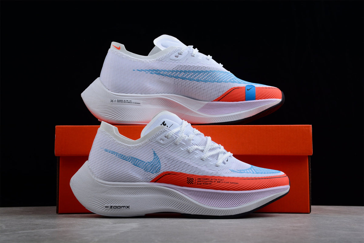 Zoom - Vaporfly Ne - T% 2 And Orange - White Unisex Streetwear Limited Edition - The Nike ZoomX Vaporfly NEXT% 2 is a high-performance running shoe designed for elite runners.