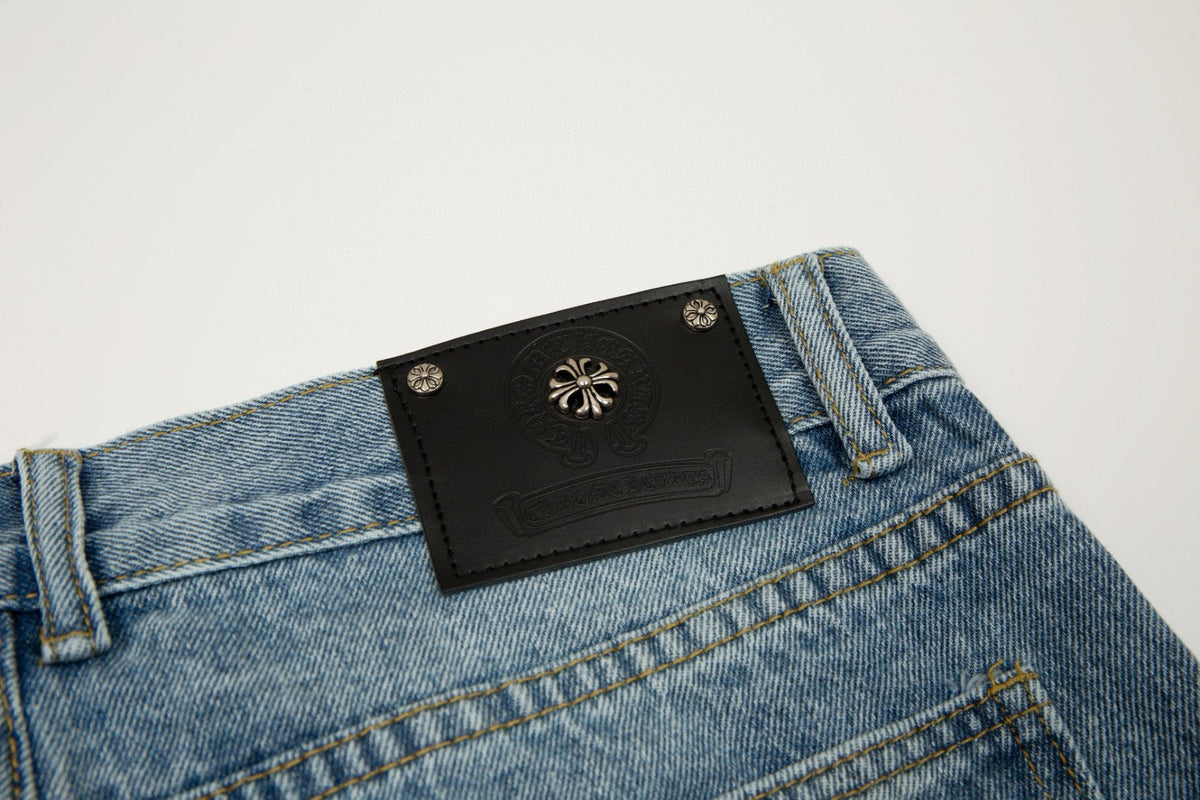 CHROME HEARTS X LEVI'S CROSS PATCH JEANS - close up - replica sneakers