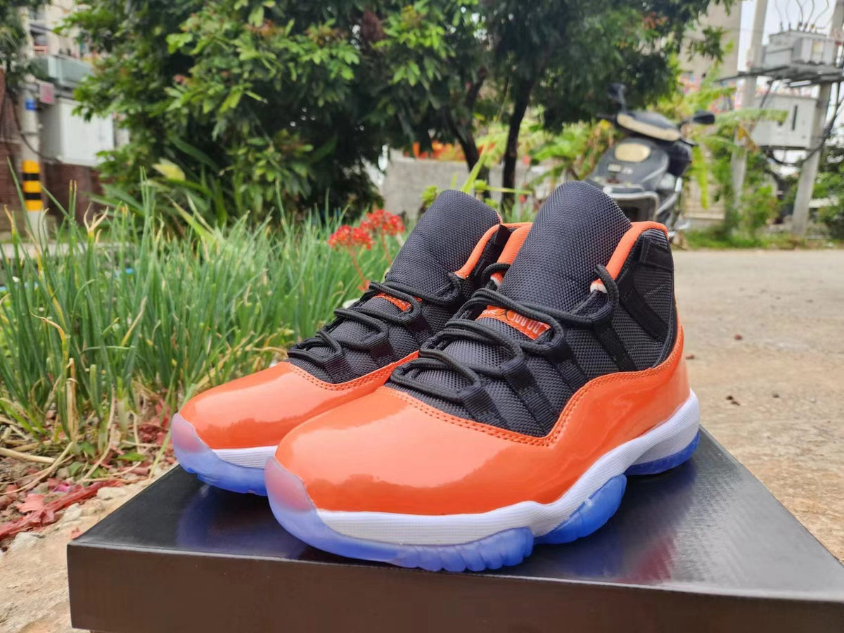 JORDAN 11 Orange And - Black Unisex Streetwear Limited Edition - The Air Jordan 11 in this vibrant orange and black colorway is a bold addition