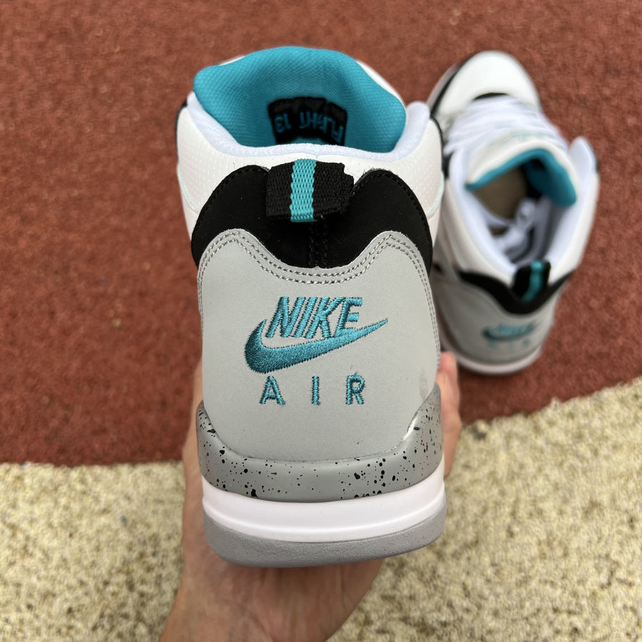 Jordan 13 Flight Mid Sneakers - Black Unisex Streetwear Limited Edition - The sneaker featured in the image is the Nike Air Flight 89 'White/Cool Grey/Aquamarine,' a