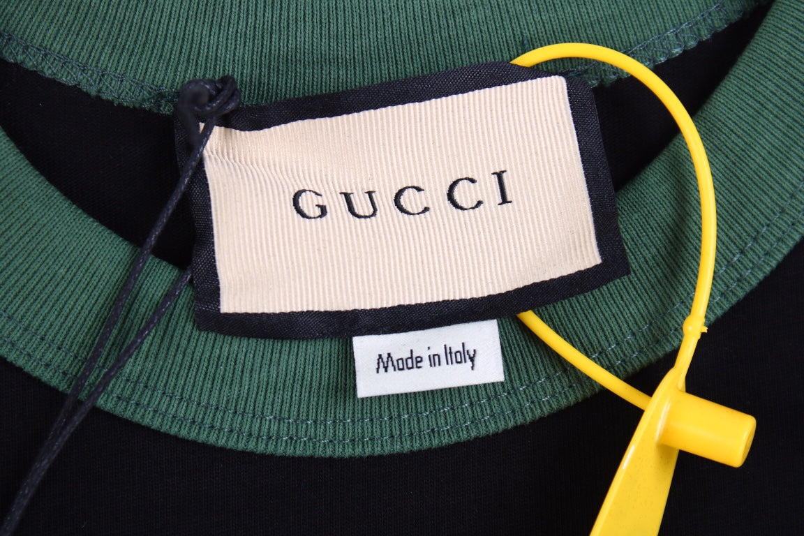 Gucci Polo Shirt with Embroidered Logo - close up - replica sneakers