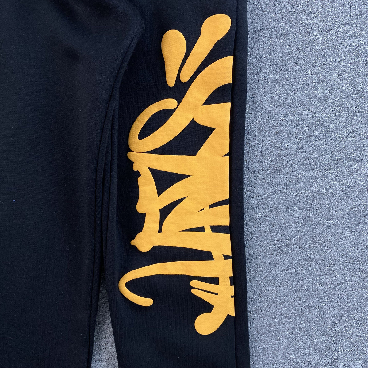 SYNA WORLD SWEATPANTS BLACK - close up - replica sneakers