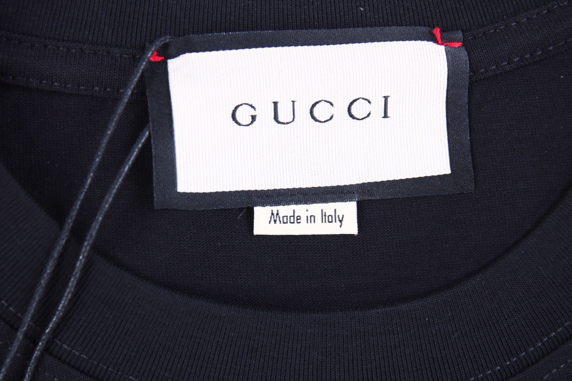 Gucci Lightning Bolt Logo T-Shirt in Black - close up - replica sneakers