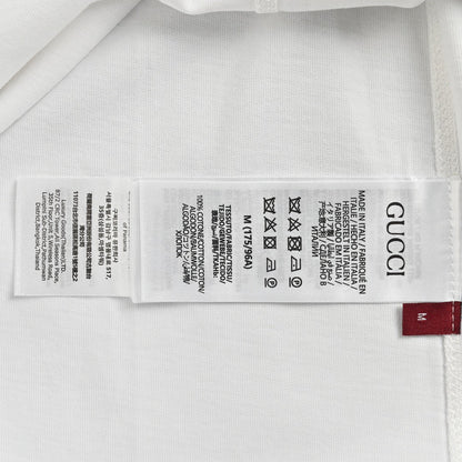 Gucci White T-Shirt with Blue Vertical Logo Patch - close up - replica sneakers