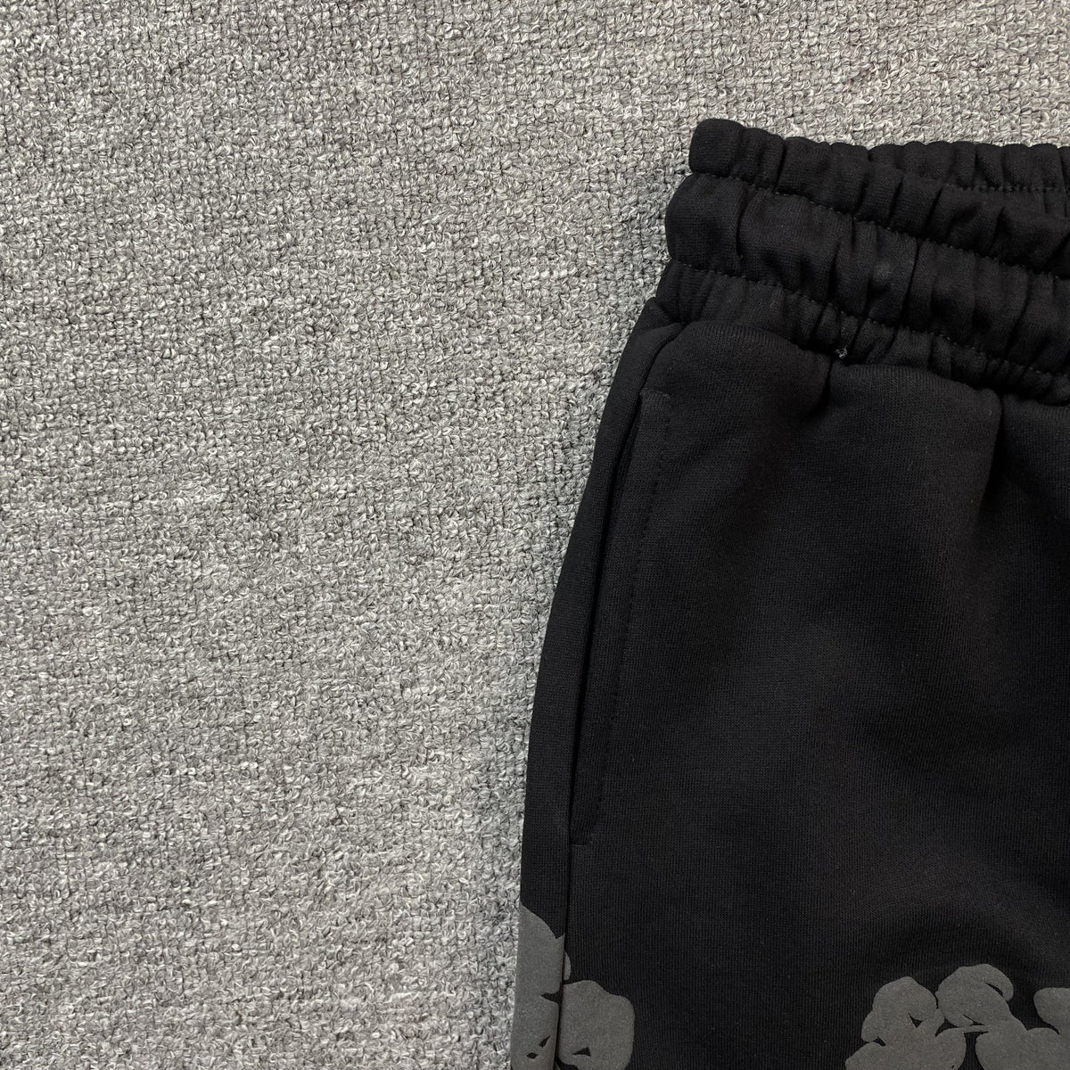 DENIM TEARS COTTON WREATH SWEATPANTS MONOCHROME BLACK - close up - replica sneakers