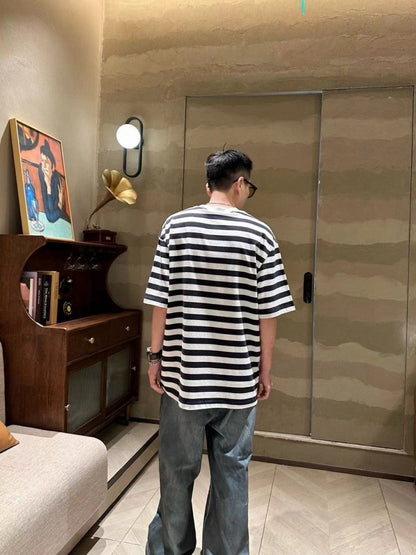 Balenciaga Black and White Striped T-Shirt - close up - replica sneakers