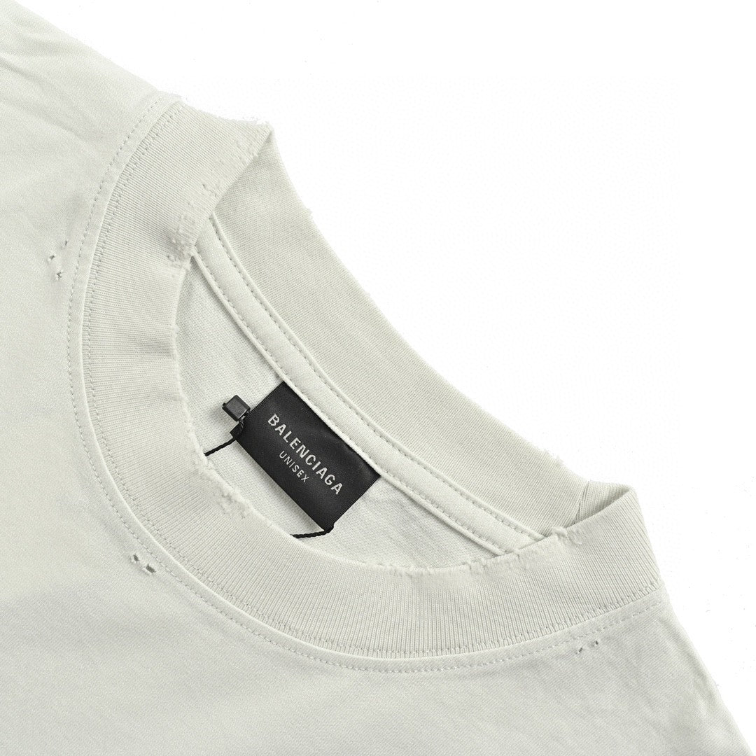 Balenciaga Distressed Logo T-Shirt in White - close up - replica sneakers