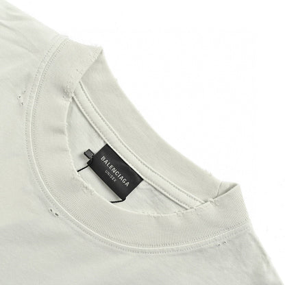 Balenciaga Distressed Logo T-Shirt in White - close up - replica sneakers