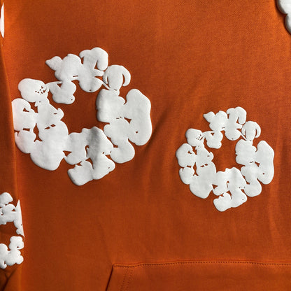 DENIM TEARS COTTON WREATH HOODIE ORANGE - close up - replica sneakers