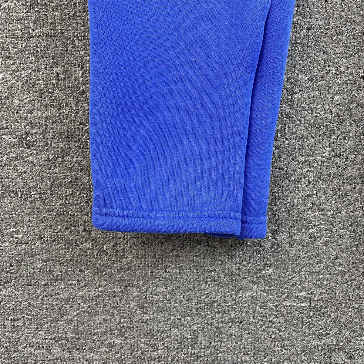 SYNA WORLD SWEATPANTS BLUE - close up - replica sneakers