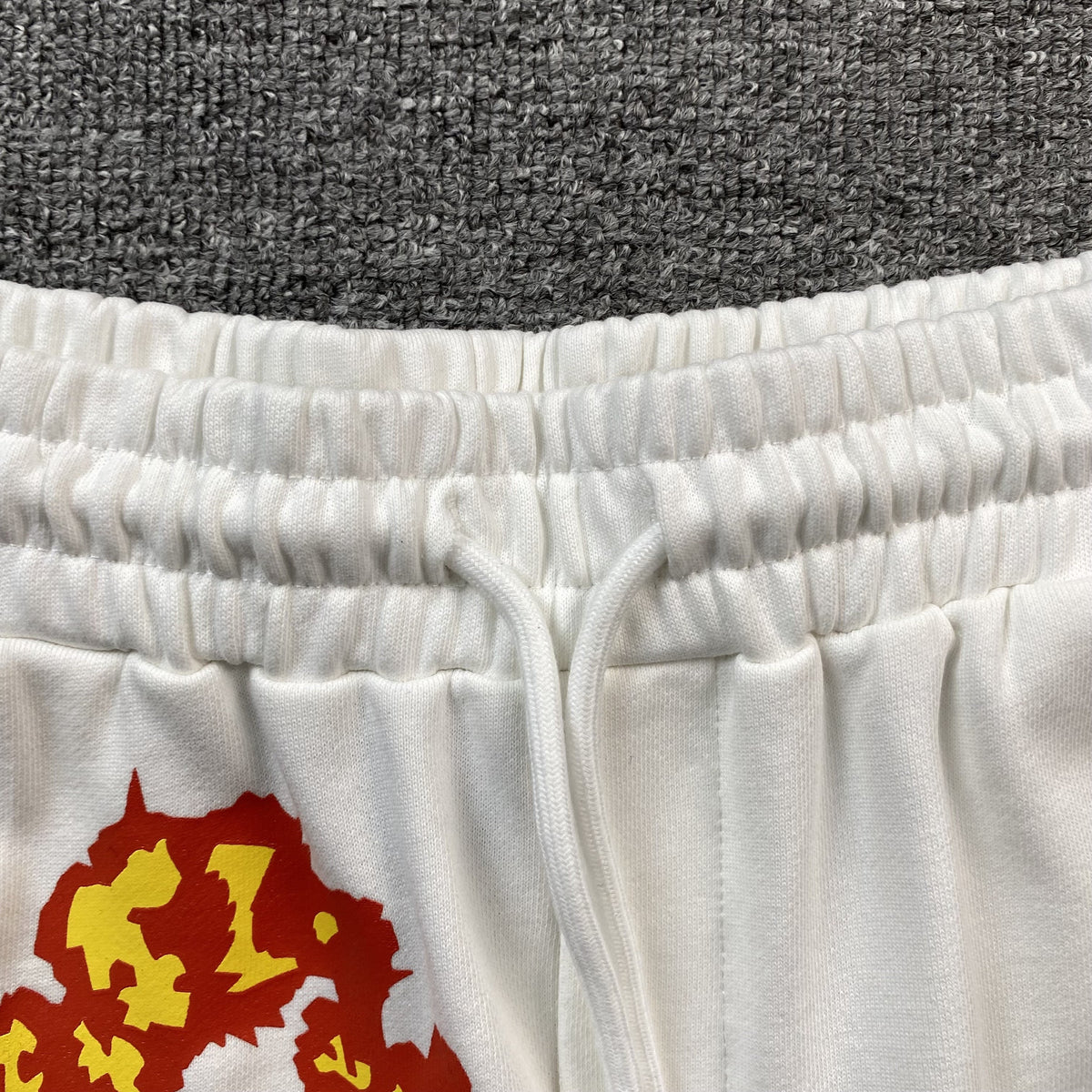 DENIM TEARS x OFFSET COTTON WREATH SHORTS WHITE - close up - replica sneakers