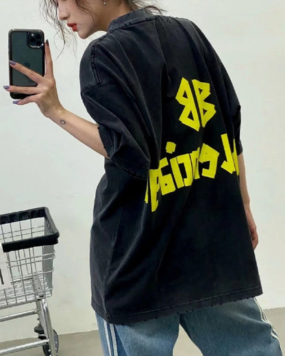 BALENCIAGA LOGO T-SHIRT BLACK YELLOW - close up - replica sneakers